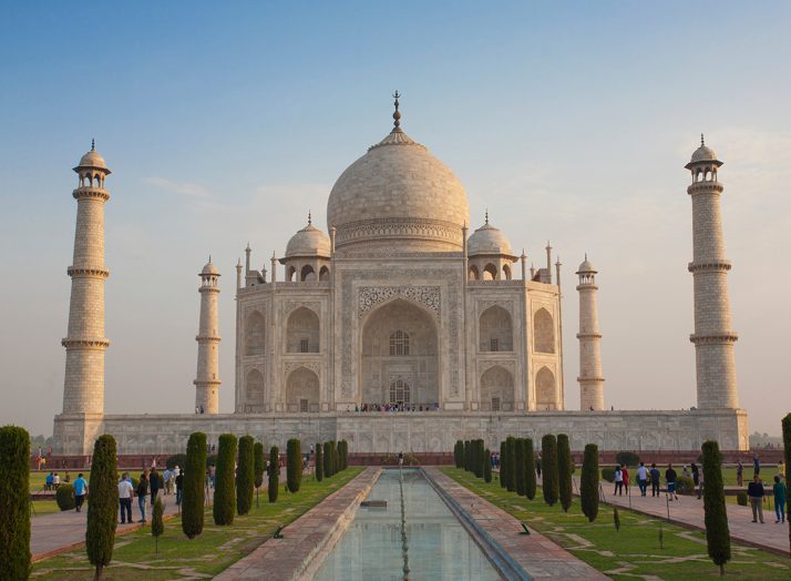 Students walk around the Taj Mahal, India