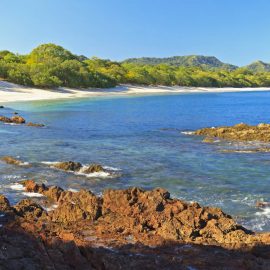 Panorama of quiet, beautiful Playa Conchal and the azure waters of the Pacific Ocean in Guanacaste, Costa RIca
