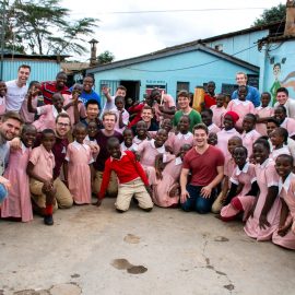 A cappella group visiting with students in Kenya
