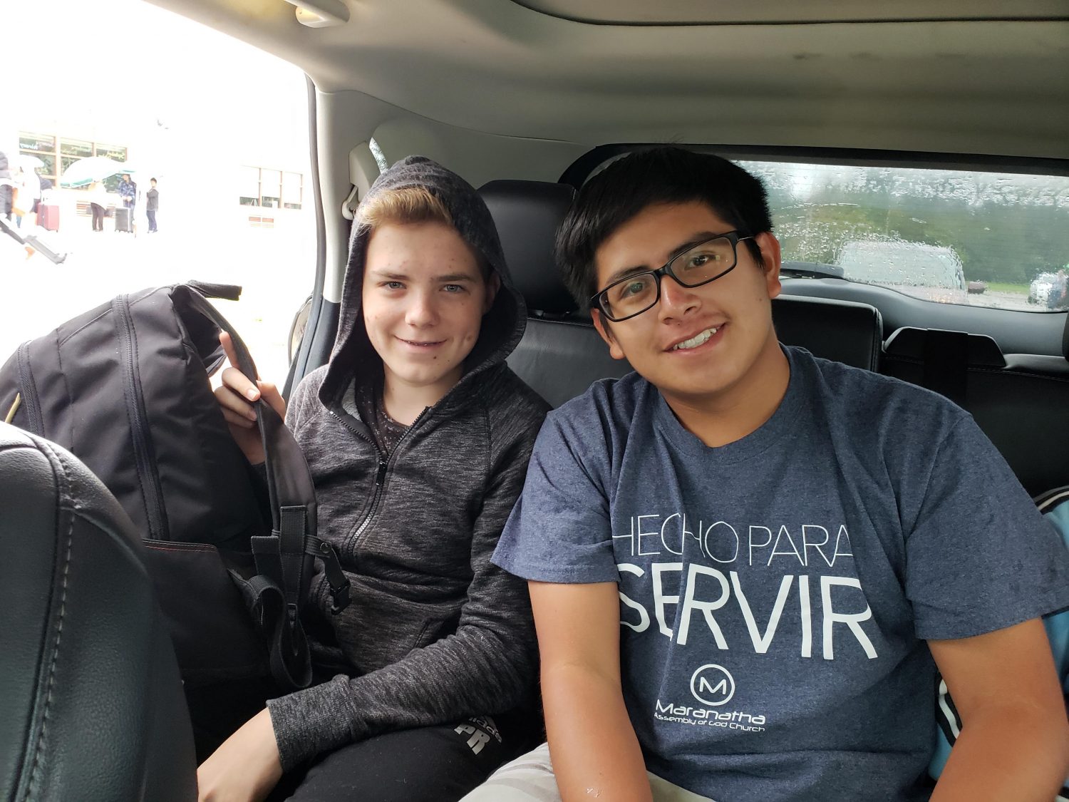 a photo of ethan wilkinson and a friend as they prepare to exit a car and begin their amazing costa rica excursion