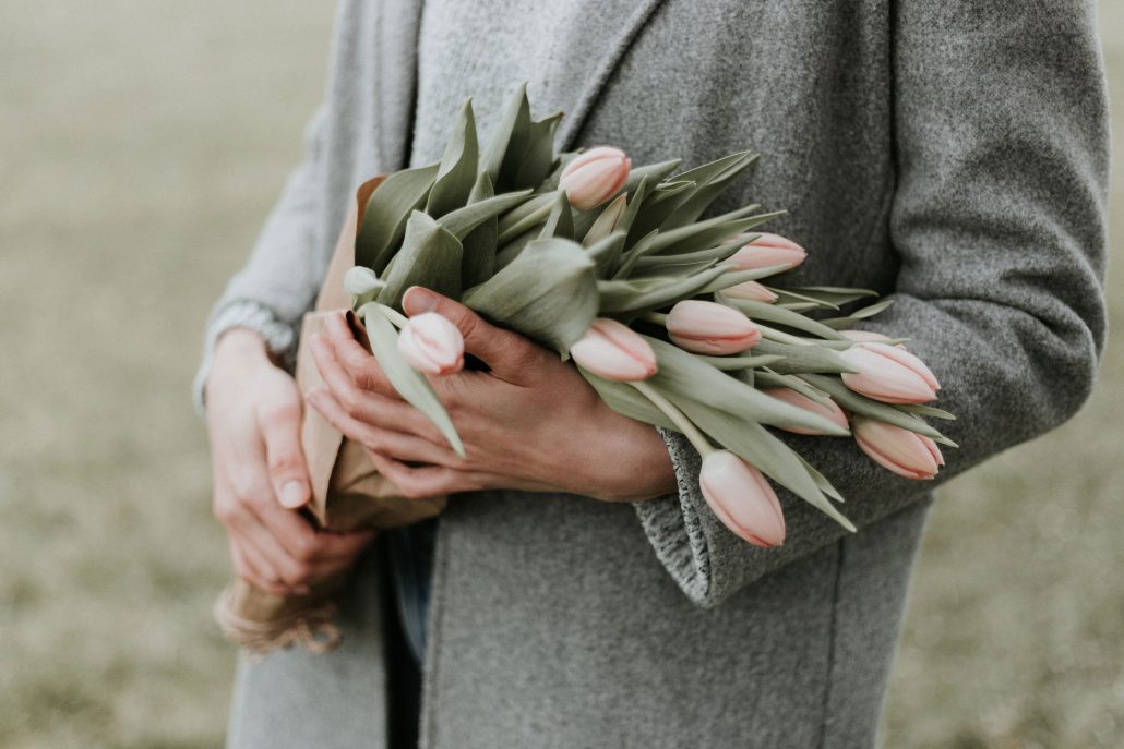 Woman holding flowers, mother's day