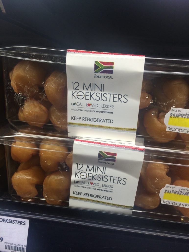 Two clear plastic containers with koeksister donuts insider