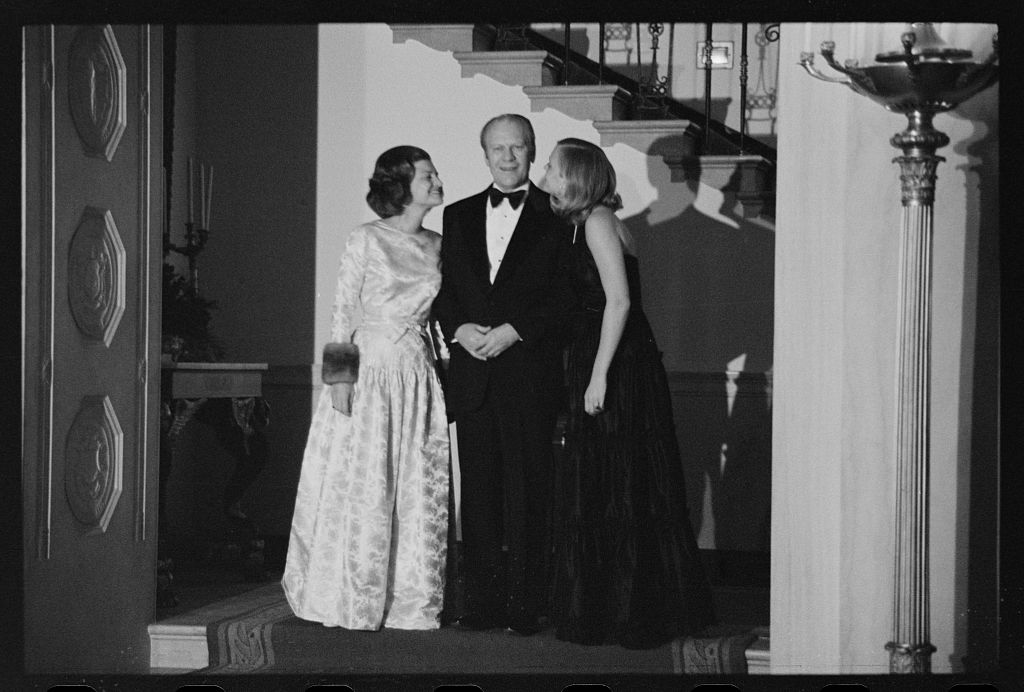 [President Gerald Ford, First Lady Betty Ford, and daughter Susan Ford at a White House Christmas party, Washington, D.C.]