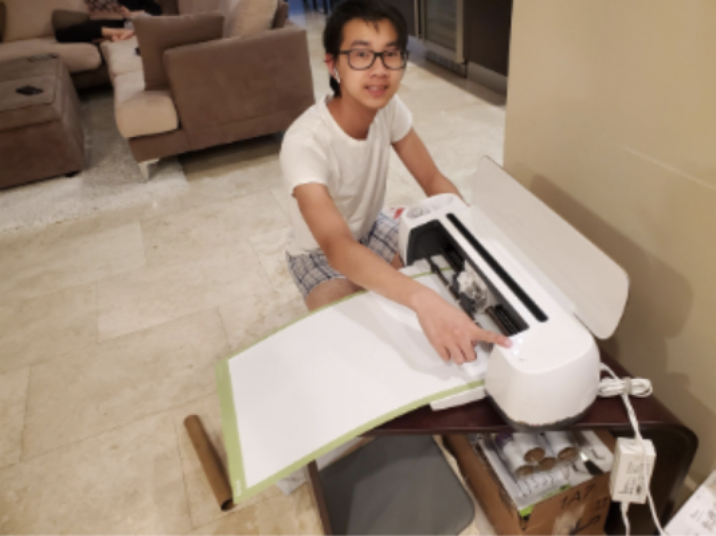 Teenage boy using printer 